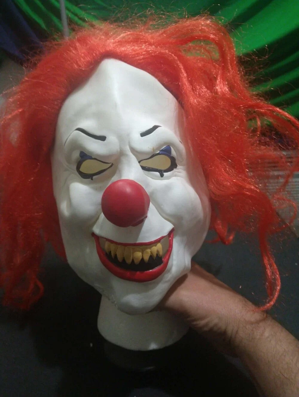 Warner Bros. / Rubie’s scary clown latex mask with bright red synthetic hair